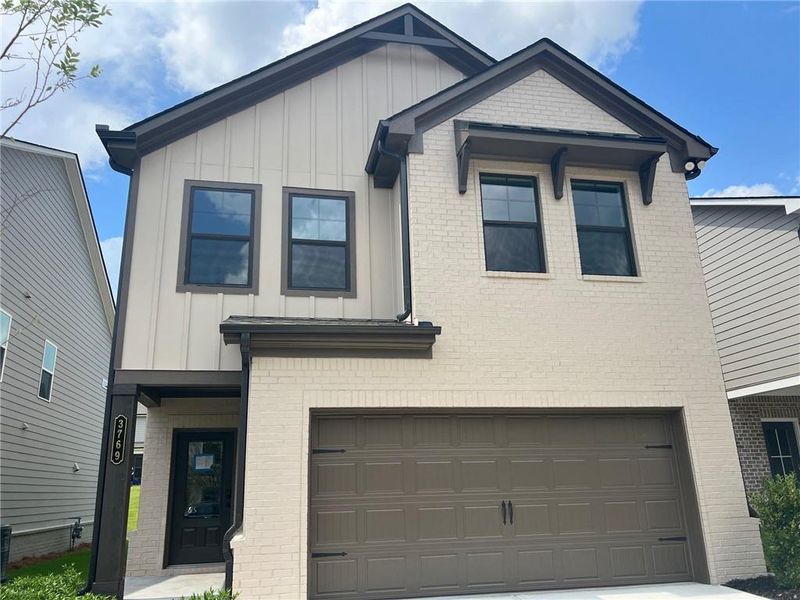 Front exterior of a new home in Crofton Place Enclave, Snellville, GA, highlighting curb appeal (Image 1). Front exterior of a new home in Crofton Place Enclave, Snellville, GA, highlighting curb appeal (Image 1).