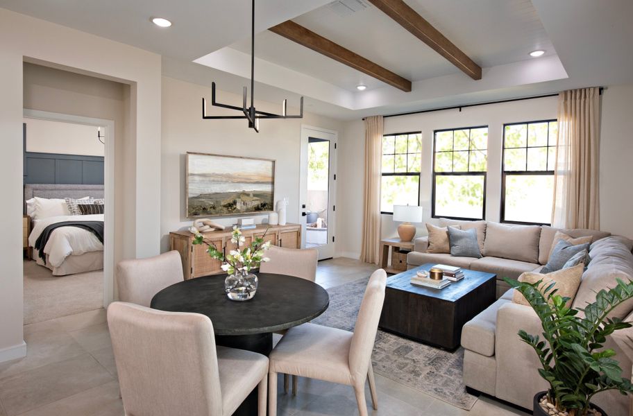 Dining area with stained ceiling beams Dining area with stained ceiling beams