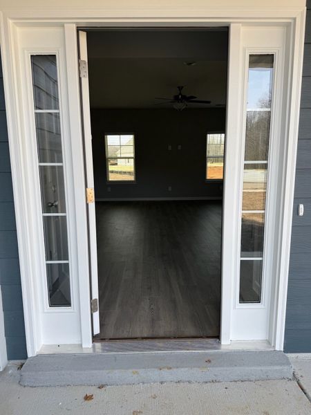 The craftsman front door door welcomes you and your guest into a warm & inviting home. The entire first floor has laminate flooring.