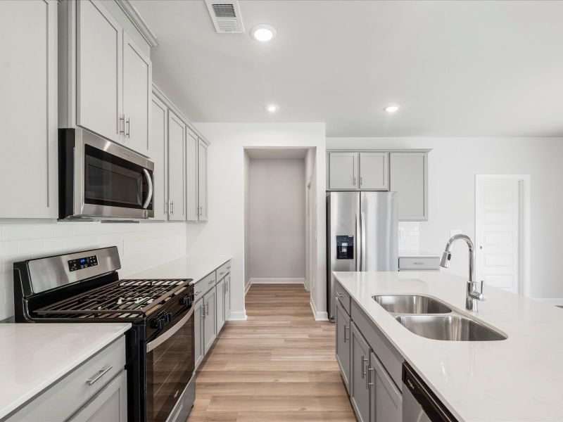 Furnished interior view inside a new home in The Farm at Wells Creek - Signature Collection, Gray Court (Image 8).