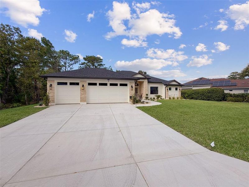 Front exterior of a new home in , Homosassa, FL, highlighting curb appeal (Image 36). Front exterior of a new home in , Homosassa, FL, highlighting curb appeal (Image 36).