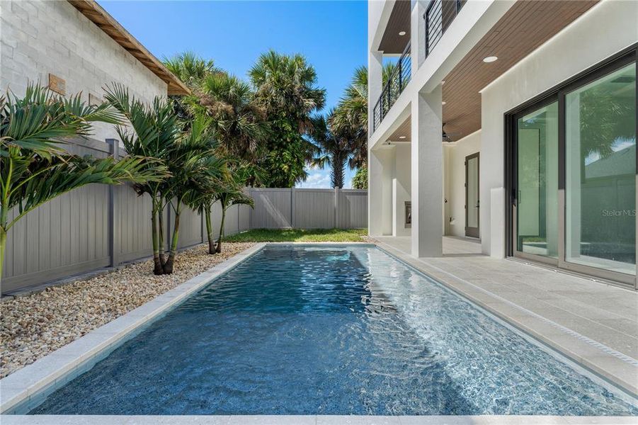 Exterior details and patio area of a home in , New Smyrna Beach (Image 76).