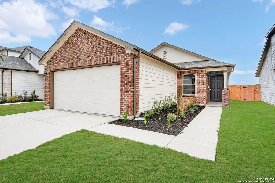 Front exterior of a new home in Park Place, New Braunfels, TX, highlighting curb appeal (Image 1).