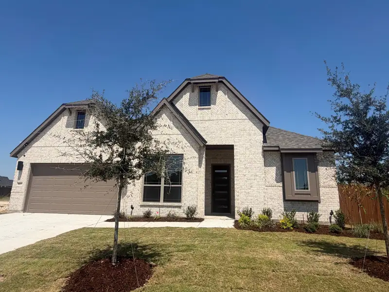 Front exterior of a new home in Ridgepoint, Midlothian, TX, highlighting curb appeal (Image 1). Front exterior of a new home in Ridgepoint, Midlothian, TX, highlighting curb appeal (Image 1).