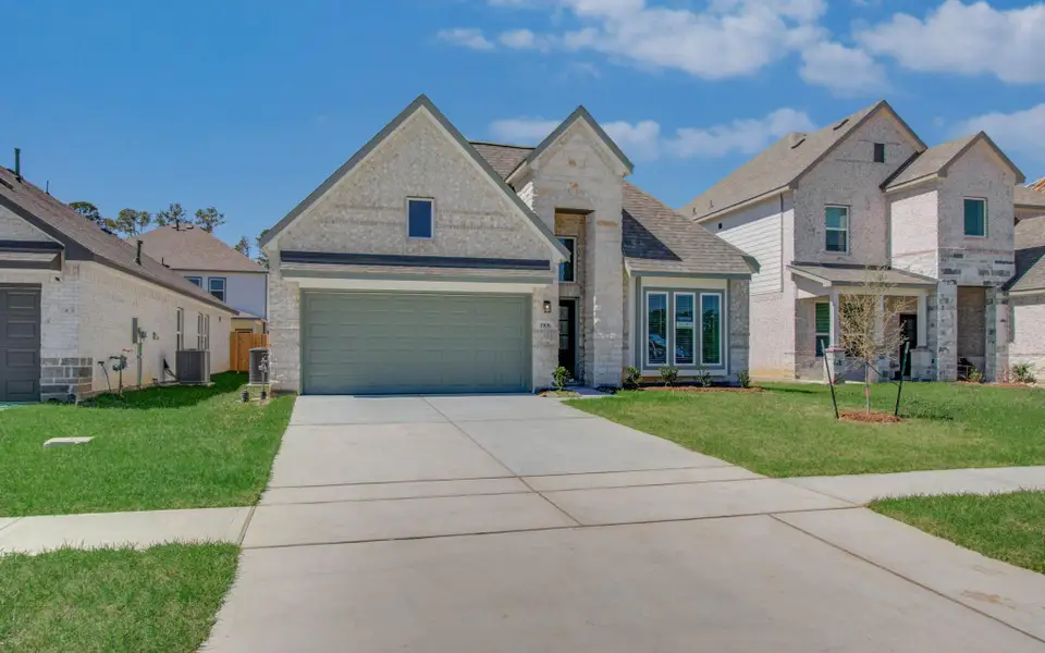 Front exterior of a new home in Harmony Cove, Humble, TX, highlighting curb appeal (Image 2). Front exterior of a new home in Harmony Cove, Humble, TX, highlighting curb appeal (Image 2).