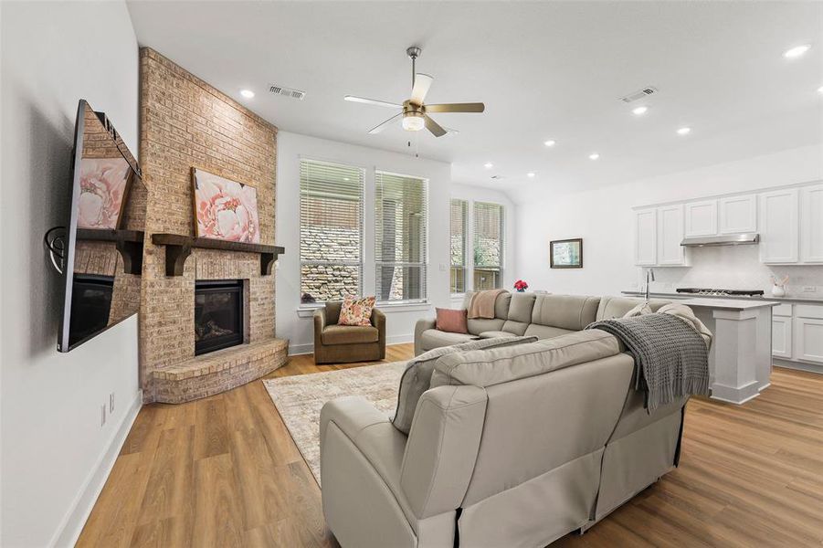 Open concept living with gas fireplace Open concept living with gas fireplace
