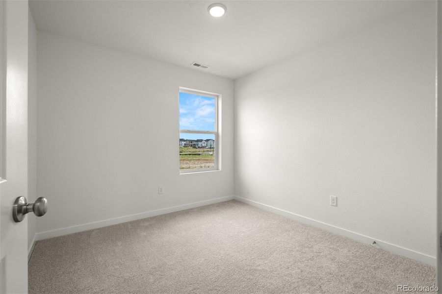 Spacious, unfurnished interior of a new home in Revel Crossing at Wolf Ranch – The Ascent Collection, Colorado Springs (Image 17).
