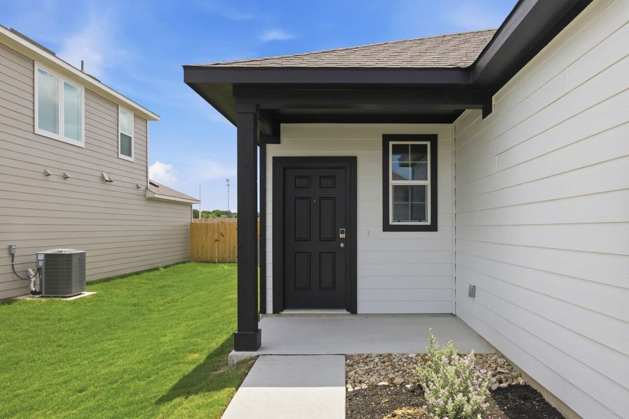 Exterior details and patio area of a home in Stallion Run, Buda (Image 3).