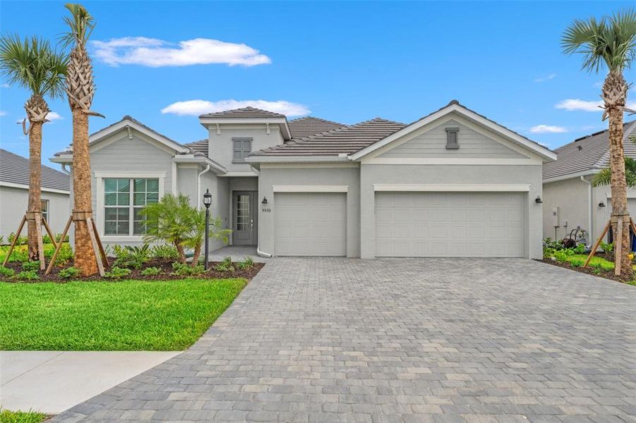 Front exterior of a new home in , Lakewood Ranch, FL, highlighting curb appeal (Image 2). Front exterior of a new home in , Lakewood Ranch, FL, highlighting curb appeal (Image 2).