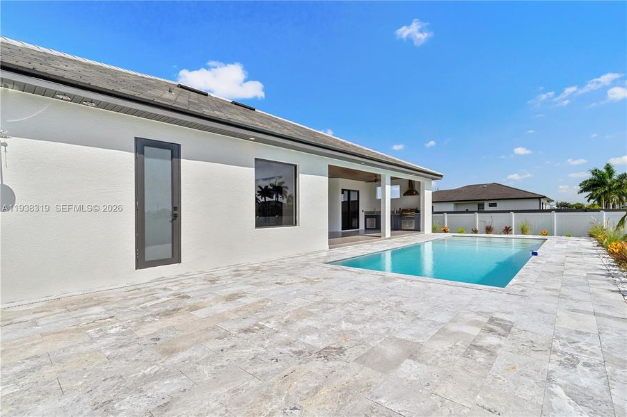 A convenient cabana half bathroom provides easy pool access, enhancing comfort for outdoor entertaining and poolside use.