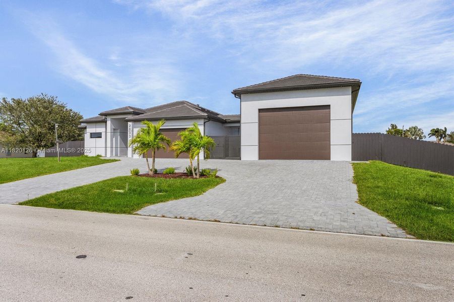 Front exterior of a new home in , Cape Coral, FL, highlighting curb appeal (Image 22).