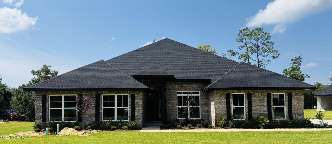 Front exterior of a new home in Cedar Creek at Deerpoint Lake, Panama City, FL, highlighting curb appeal (Image 1). Front exterior of a new home in Cedar Creek at Deerpoint Lake, Panama City, FL, highlighting curb appeal (Image 1).
