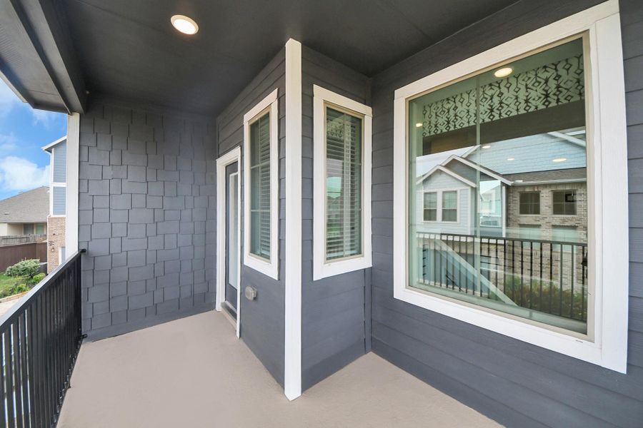 Exterior details and patio area of a home in The Groves, Humble (Image 3).