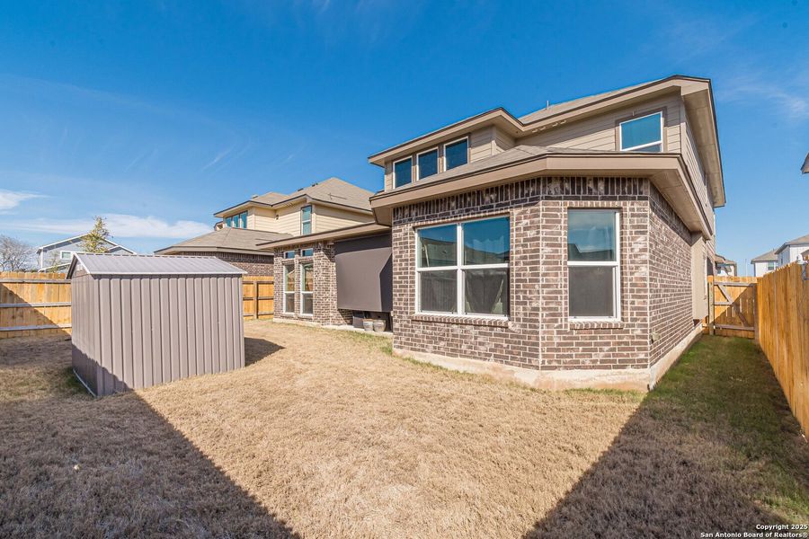 Front exterior of a new home in Hiddenbrooke, Seguin, TX, highlighting curb appeal (Image 1).