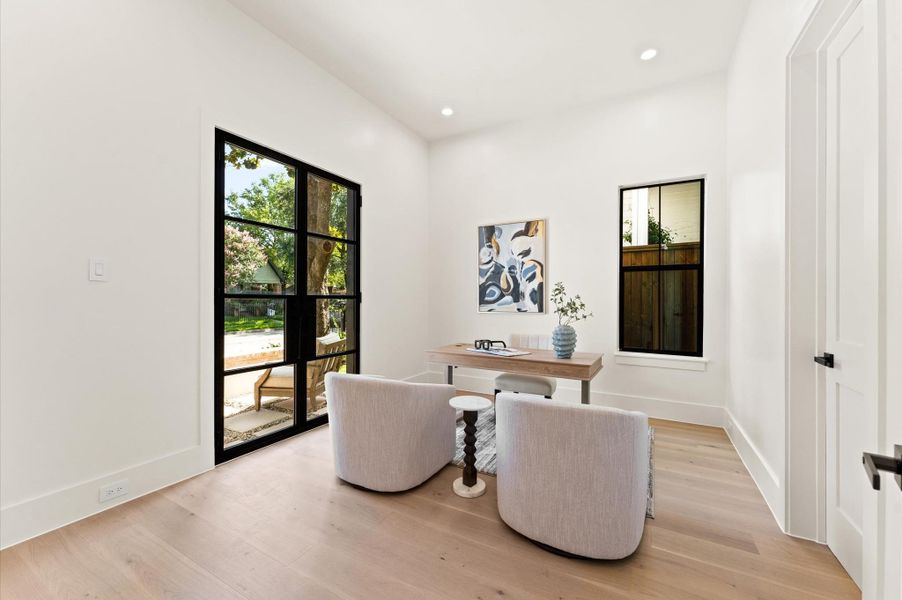 Adjacent to the foyer, you'll find the study/optional bedroom with bath. Steel French doors open to an inviting 10 ft front patio surrounded by a 3 ft brick wall-a great outdoor area to enjoy! Adjacent to the foyer, you'll find the study/optional bedroom with bath. Steel French doors open to an inviting 10 ft front patio surrounded by a 3 ft brick wall-a great outdoor area to enjoy!