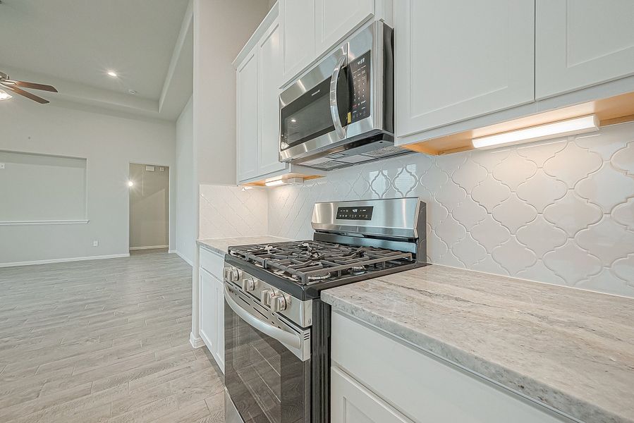 Representative furnished interior of a home built from the Floor Plan 2050 by Colina Homes in Grand Magnolia, Magnolia (Image 15).
