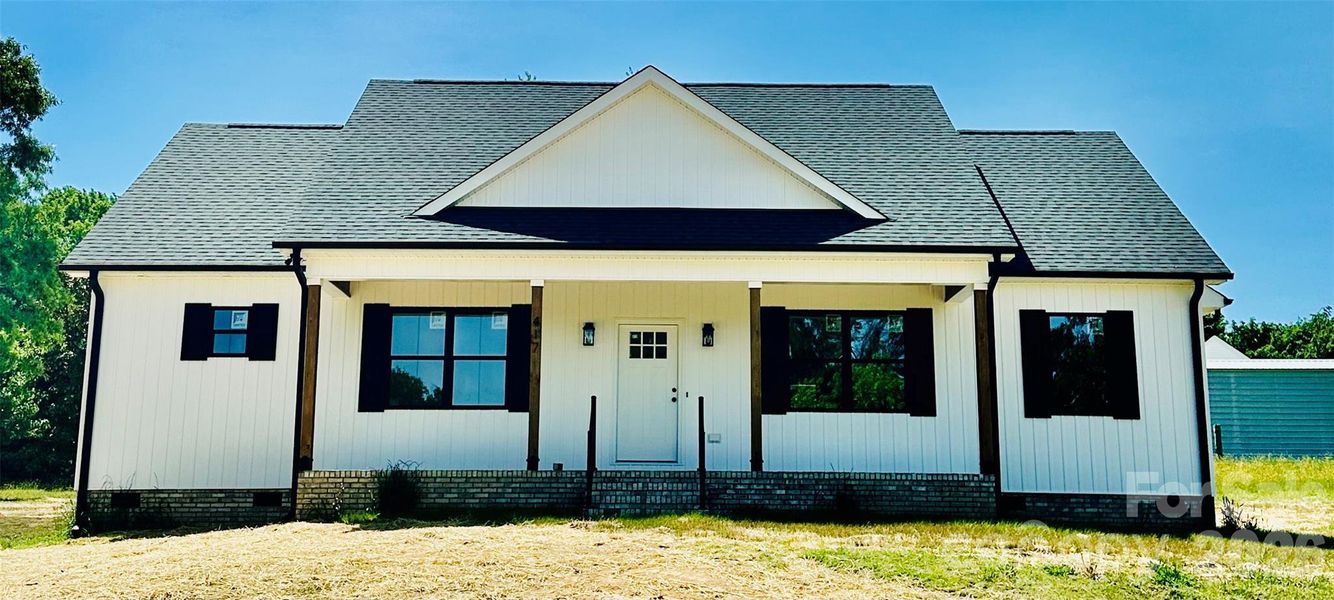 Front exterior of a new home in , Faith, NC, highlighting curb appeal (Image 1). Front exterior of a new home in , Faith, NC, highlighting curb appeal (Image 1).