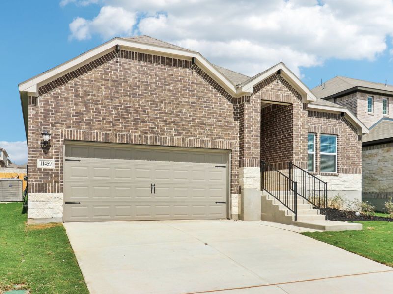 Front exterior of a new home in Sagebrooke - Classic Series, San Antonio, TX, highlighting curb appeal (Image 20). Front exterior of a new home in Sagebrooke - Classic Series, San Antonio, TX, highlighting curb appeal (Image 20).