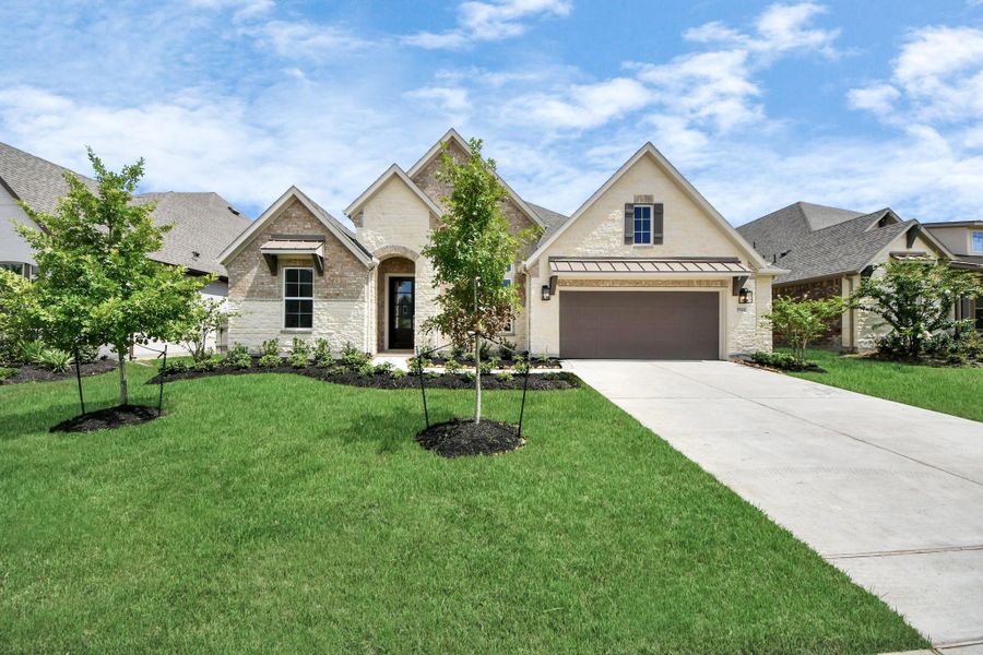 Front exterior of a new home in ARTAVIA: Hilltop Collection, Conroe, TX, highlighting curb appeal (Image 22). Front exterior of a new home in ARTAVIA: Hilltop Collection, Conroe, TX, highlighting curb appeal (Image 22).