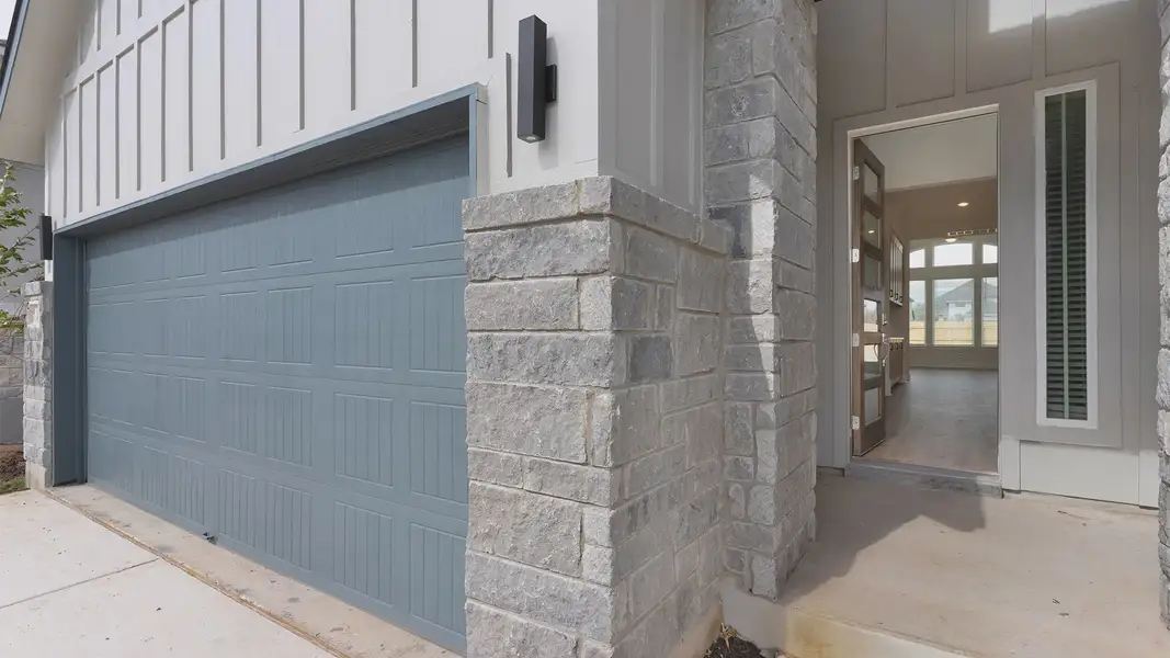 Exterior details and patio area of a home in Lariat, Liberty Hill (Image 3).