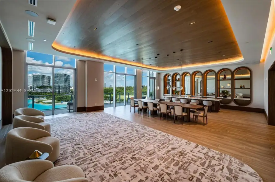 Custom wood-plank ceiling with integrated cove lighting, floor-to-ceiling glass paneling, built-in arched display shelving, and wood-finish flooring