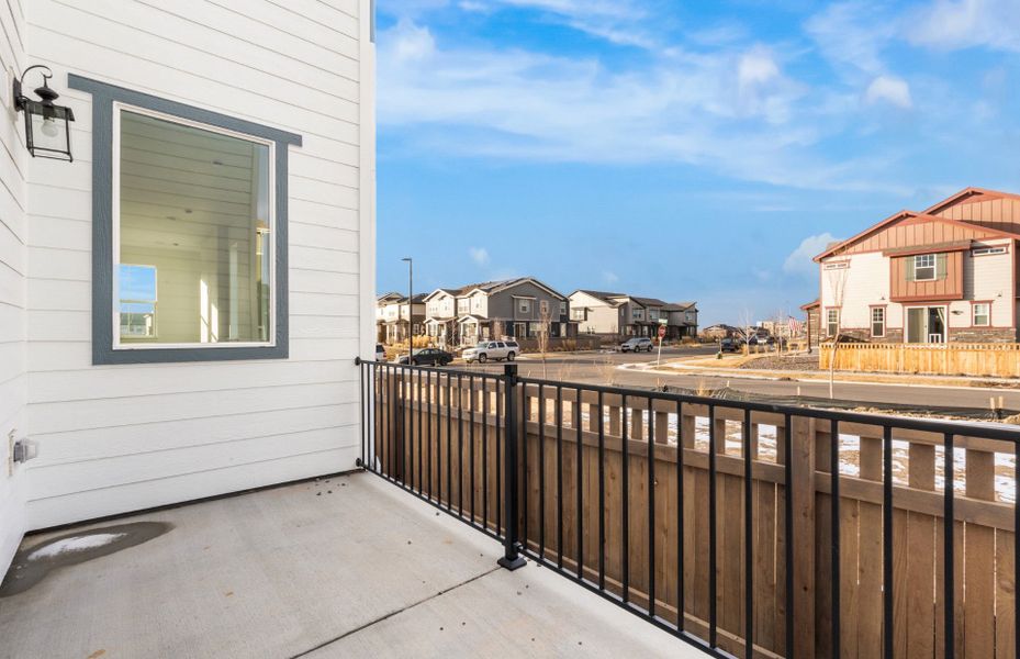 Exterior details and patio area of a home in Painted Prairie, Aurora (Image 4).