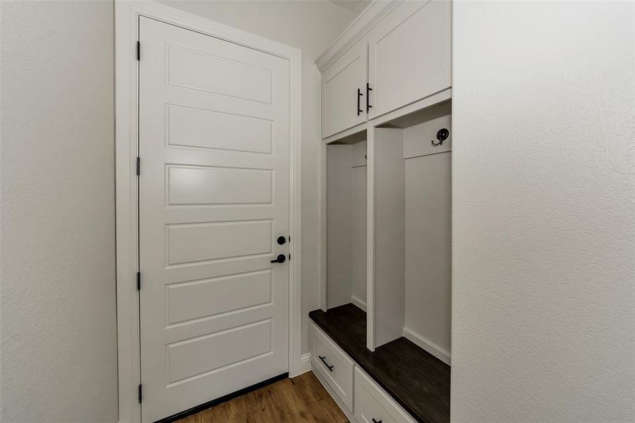 Mudroom with dark wood-type flooring