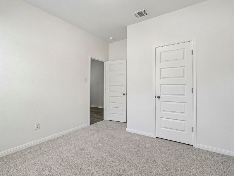 Spacious, unfurnished interior of a new home in Colony at Cole Springs - Boulevard Collection, Buda (Image 13).