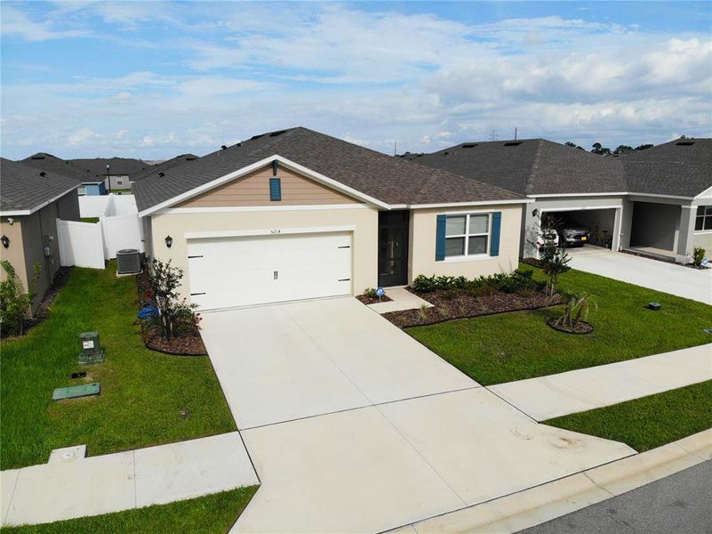 Front exterior of a new home in Wind Meadows South, Bartow, FL, highlighting curb appeal (Image 21). Front exterior of a new home in Wind Meadows South, Bartow, FL, highlighting curb appeal (Image 21).