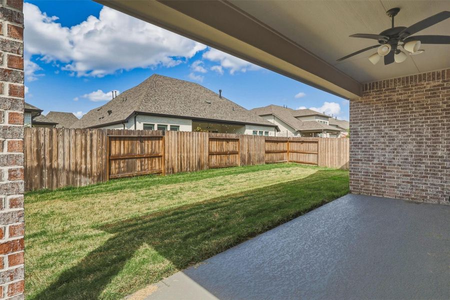 The fully fenced backyard offers a generous lawn with plenty of room for pets, outdoor games, gardening, or future additions such as a playset or custom outdoor living enhancements.