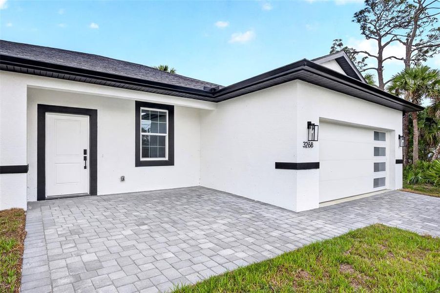 Exterior details and patio area of a home in , North Port (Image 24).