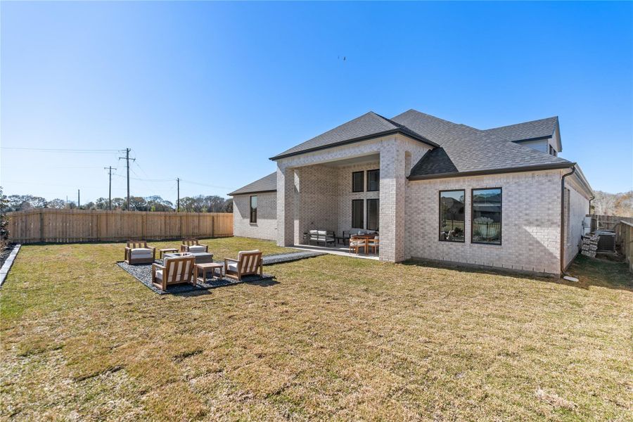 Spacious backyard area with room for an outdoor firepit Spacious backyard area with room for an outdoor firepit
