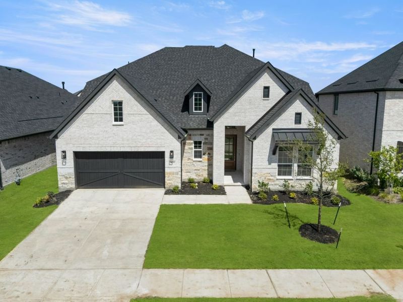 Front exterior of a new home in Cambridge Crossing, Celina, TX, highlighting curb appeal (Image 23). Front exterior of a new home in Cambridge Crossing, Celina, TX, highlighting curb appeal (Image 23).