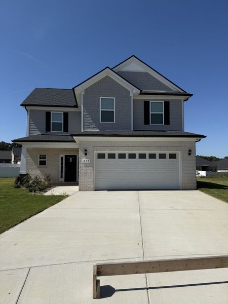Front exterior of a new home in Bradley Bend, Ashland City, TN, highlighting curb appeal (Image 2).