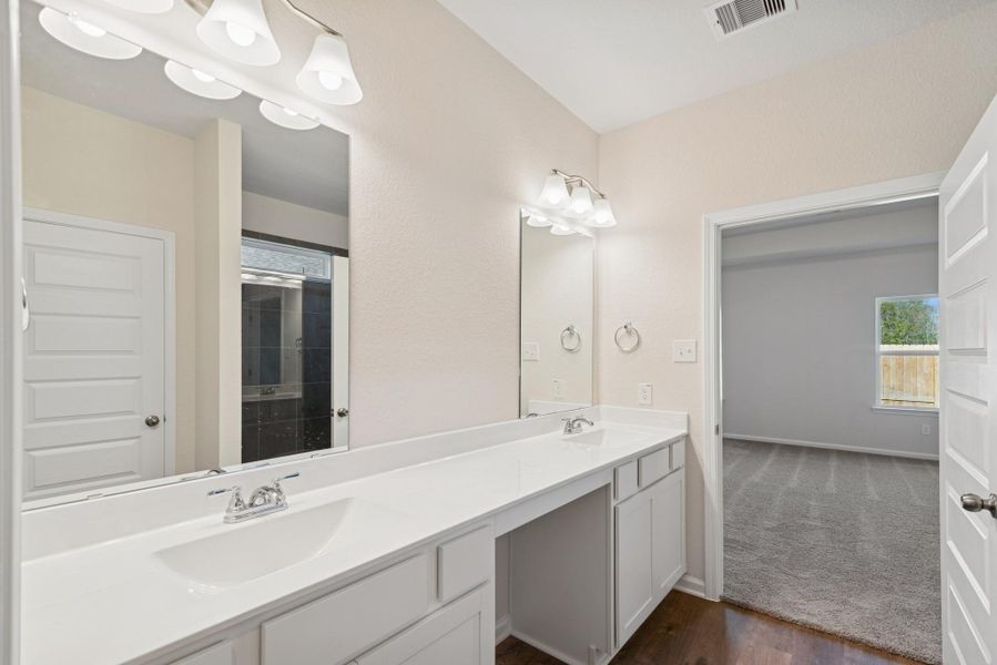 The Crawford- Primary Bath with Dual Vanities. Sample image for illustration; upgrades, options, and colors may vary. The Crawford- Primary Bath with Dual Vanities. Sample image for illustration; upgrades, options, and colors may vary.