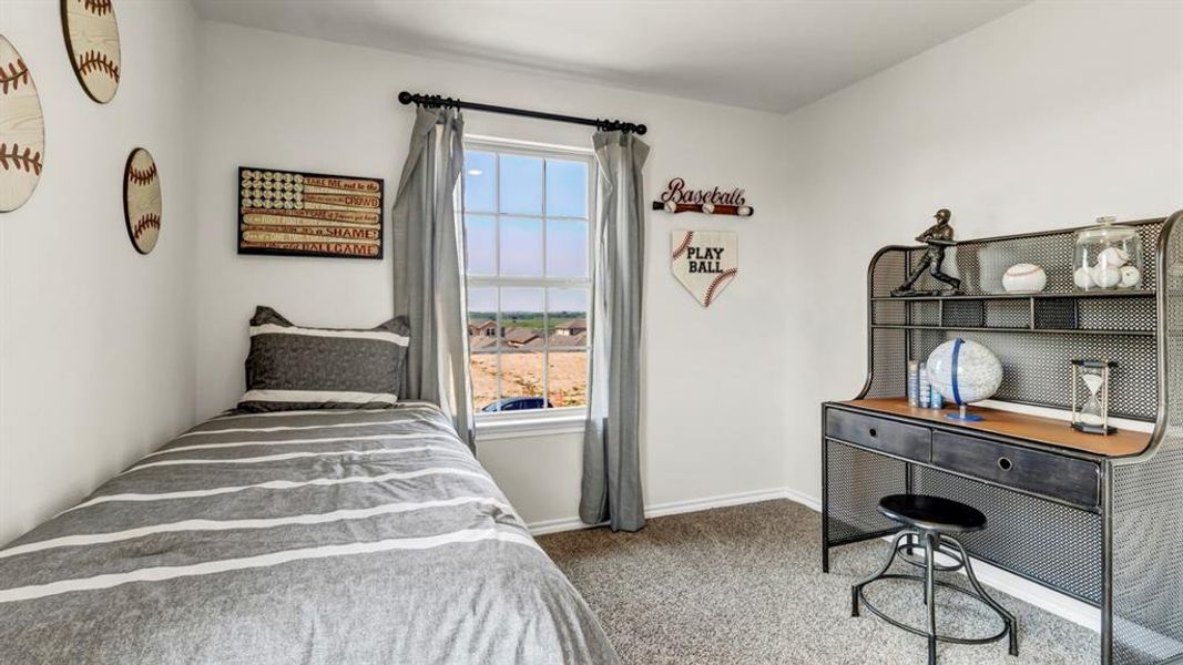 Bedroom featuring a double-hung window, light gray carpeting, crisp white walls, and a recessed ceiling Bedroom featuring a double-hung window, light gray carpeting, crisp white walls, and a recessed ceiling
