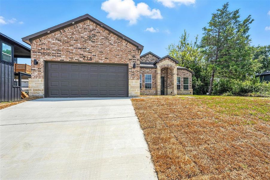 Front exterior of a new home in , Hutchins, TX, highlighting curb appeal (Image 23).