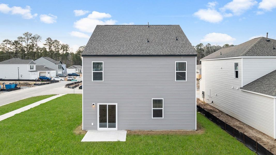 Exterior details and patio area of a home in Pine Hills at Cane Bay, Summerville (Image 3).