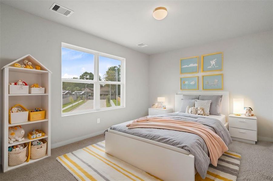 This secondary bedroom features custom paint, plush carpet, and a large window with privacy blinds!