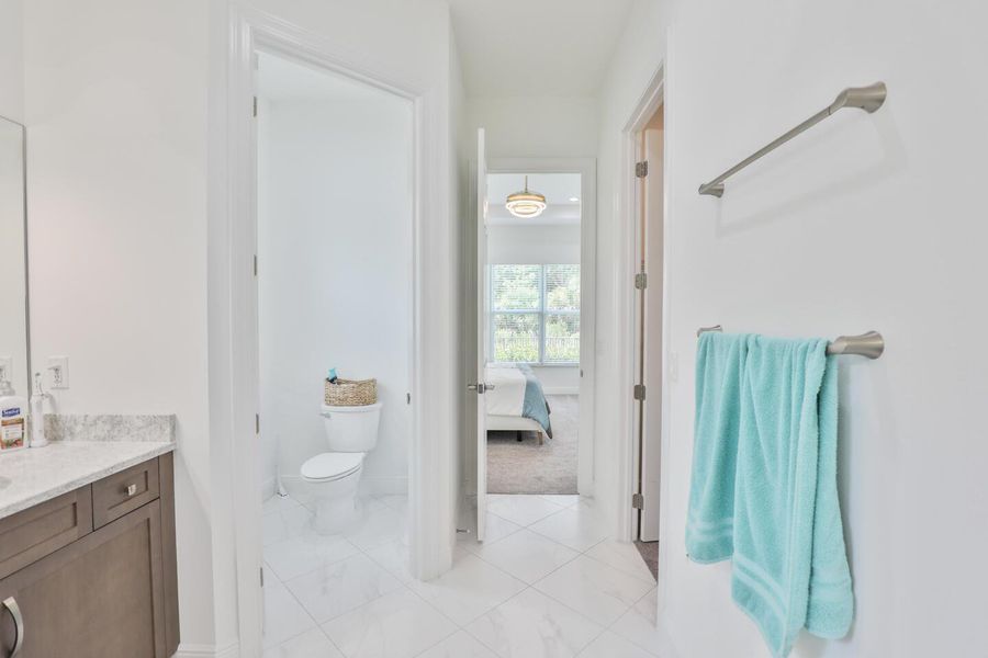 Furnished interior view inside a new home in PGA Village Verano, Port St. Lucie (Image 5).