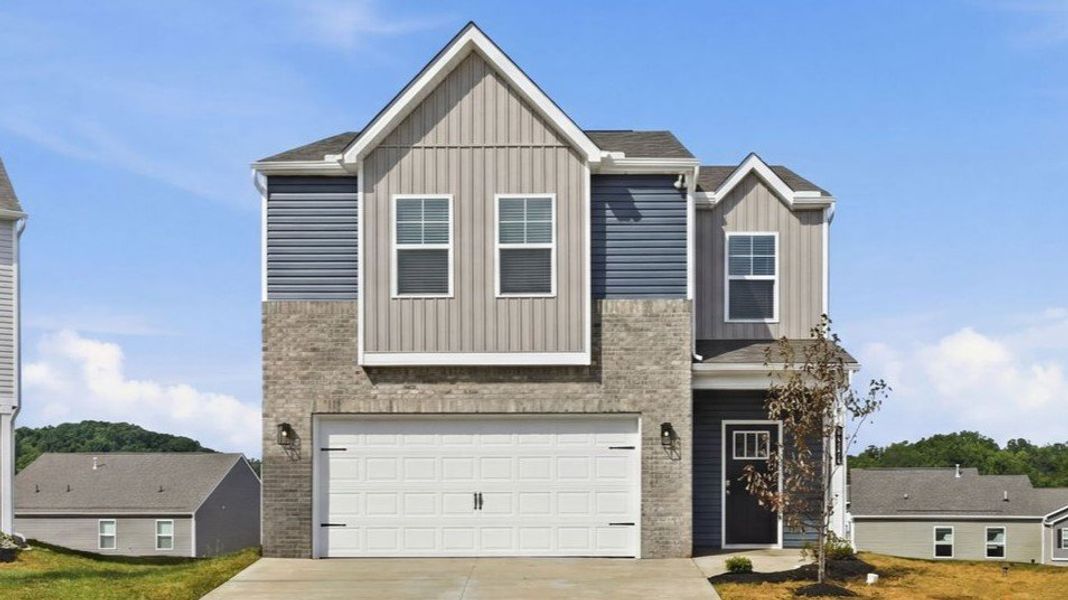 Front exterior of a new home in The Ridge at Neals Landing, Knoxville, TN, highlighting curb appeal (Image 1). Front exterior of a new home in The Ridge at Neals Landing, Knoxville, TN, highlighting curb appeal (Image 1).