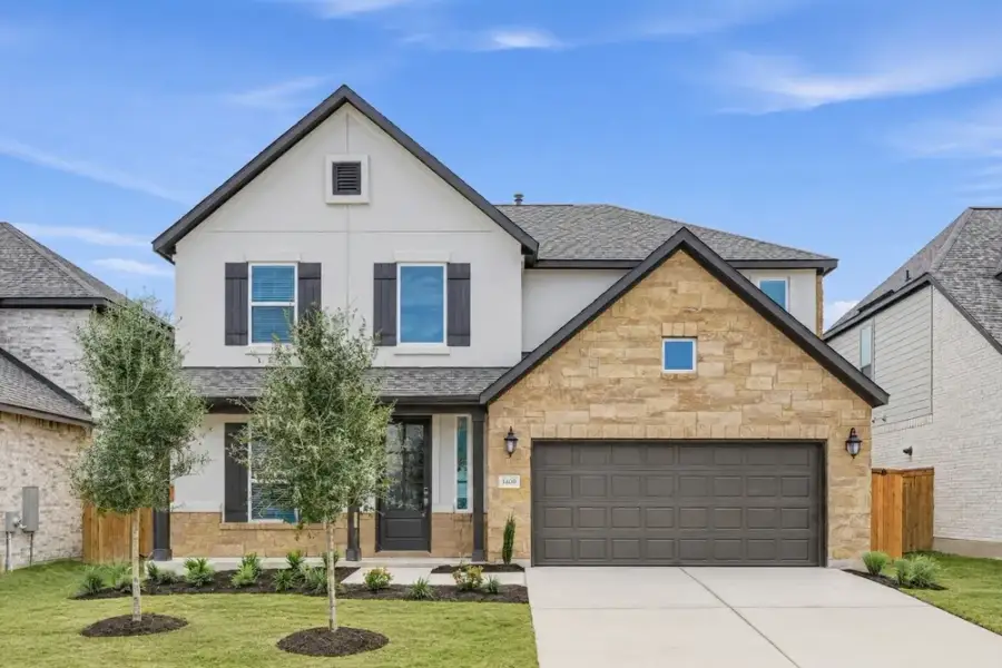 Front exterior of a new home in Parkside on the River, Georgetown, TX, highlighting curb appeal (Image 22). Front exterior of a new home in Parkside on the River, Georgetown, TX, highlighting curb appeal (Image 22).