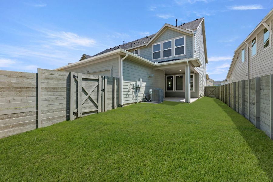 Exterior details and patio area of a home in The Retreat at Harvest, Argyle (Image 3).