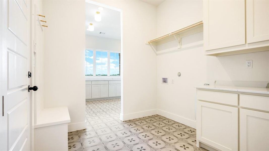 Laundry area featuring cabinets and washer hookup