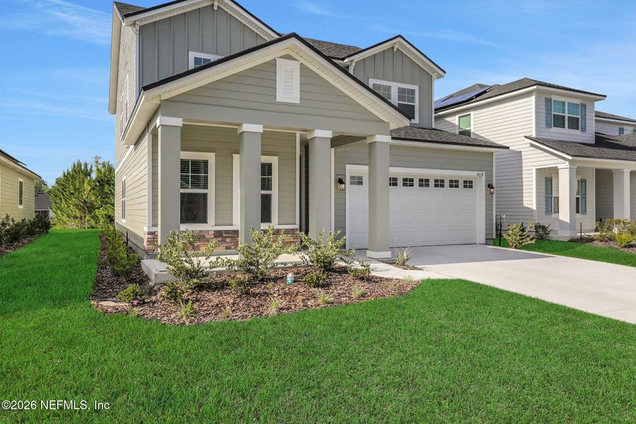 Front exterior of a new home in Hyland Trail, Green Cove Springs, FL, highlighting curb appeal (Image 25).