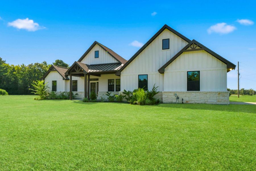 Front exterior of a new home in , Centerville, TX, highlighting curb appeal (Image 24).