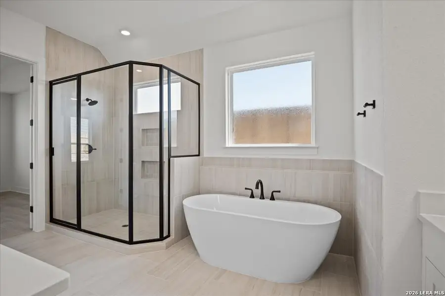 Furnished interior view inside a new home in Village at Three Oaks, Seguin (Image 6).