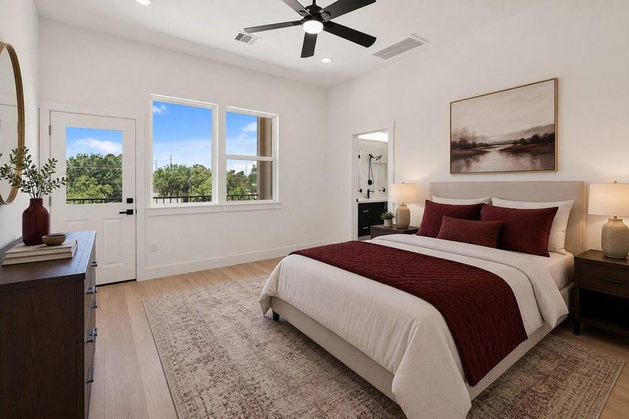 Spacious primary suite with abundant natural light, private balcony access, and a sleek en-suite bathroom.