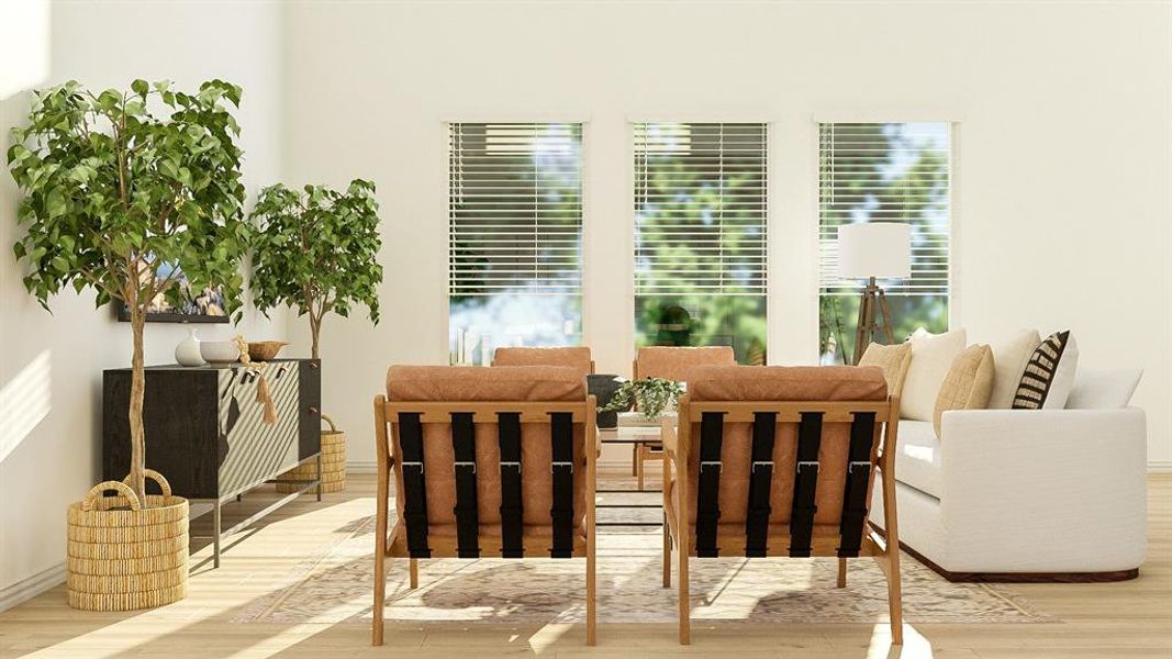 Dining area with a healthy amount of sunlight and hardwood / wood-style floors