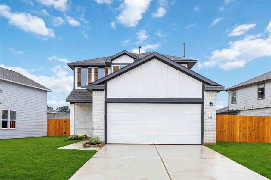 Front exterior of a new home in Granger Pines, Conroe, TX, highlighting curb appeal (Image 15). Front exterior of a new home in Granger Pines, Conroe, TX, highlighting curb appeal (Image 15).